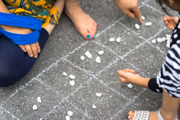 couple playing traditional Game in streets