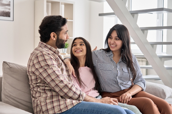 parents talking with teen at home