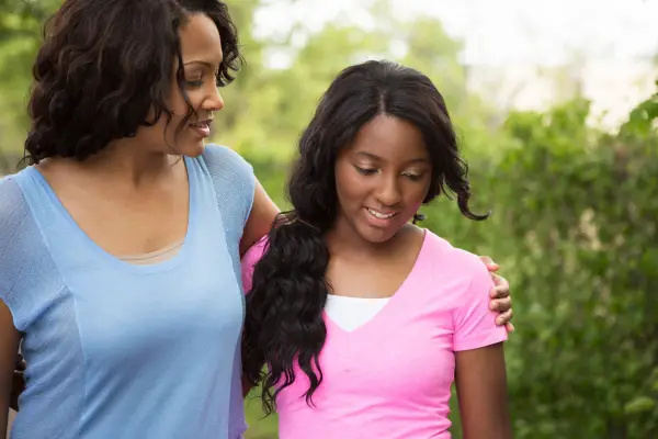 black mother with teen daughter