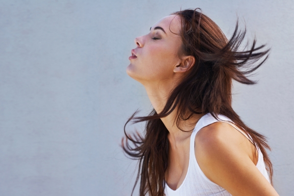 woman letting go after end of marriage, relaxing in nature