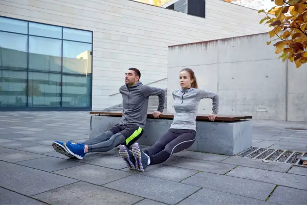 couple exercising together outside 