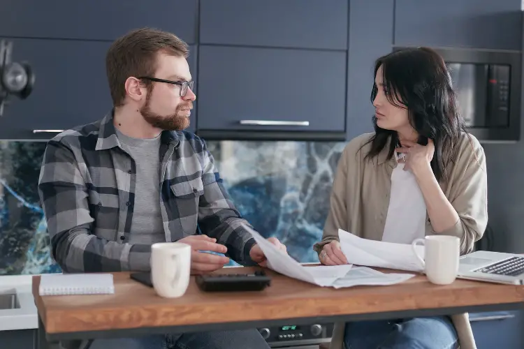 couple talking about their finances in home
