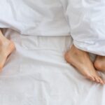 husband and wife feet in opposite direction, showing problem in relationship